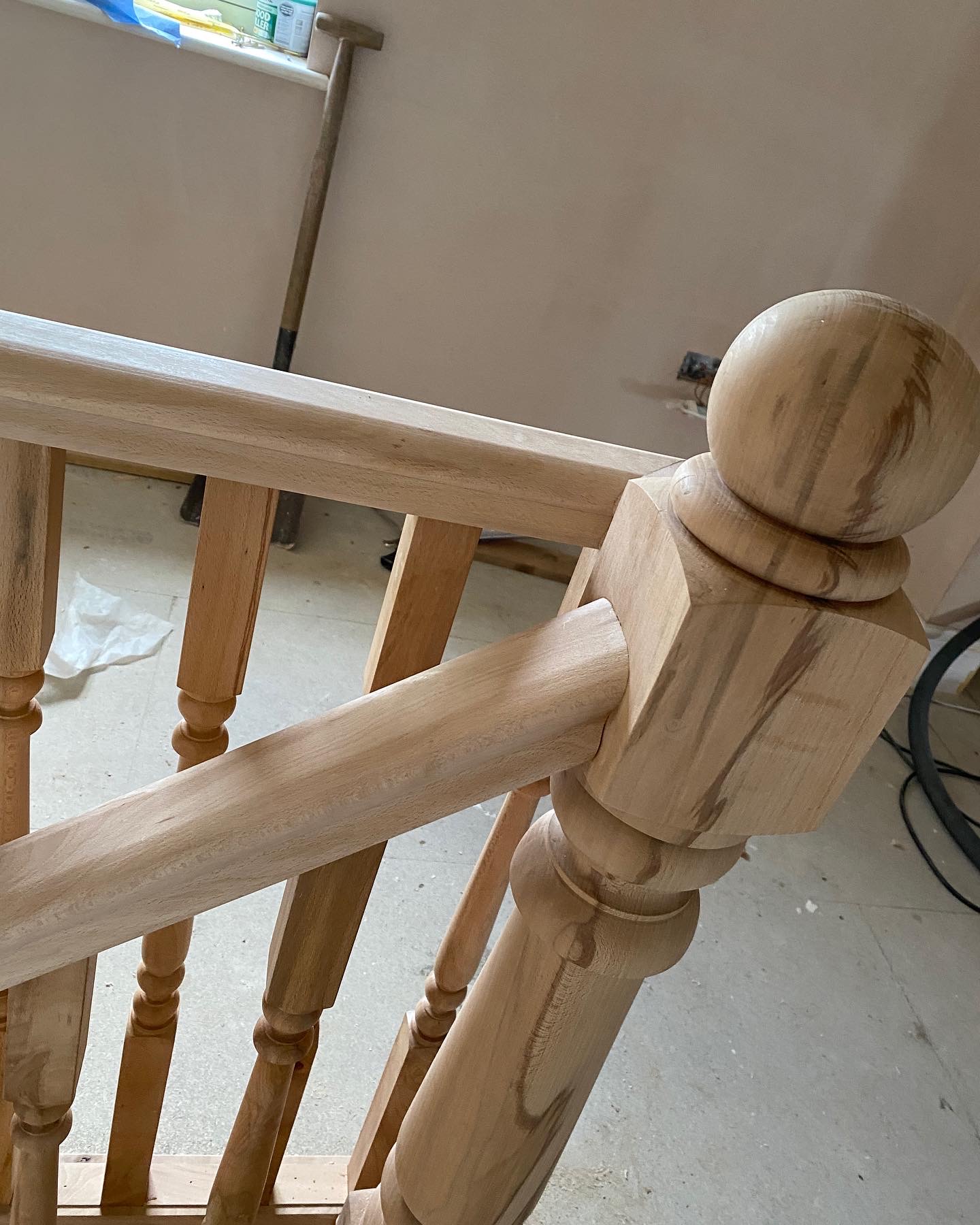 Turned newel post with ball cap and spindles