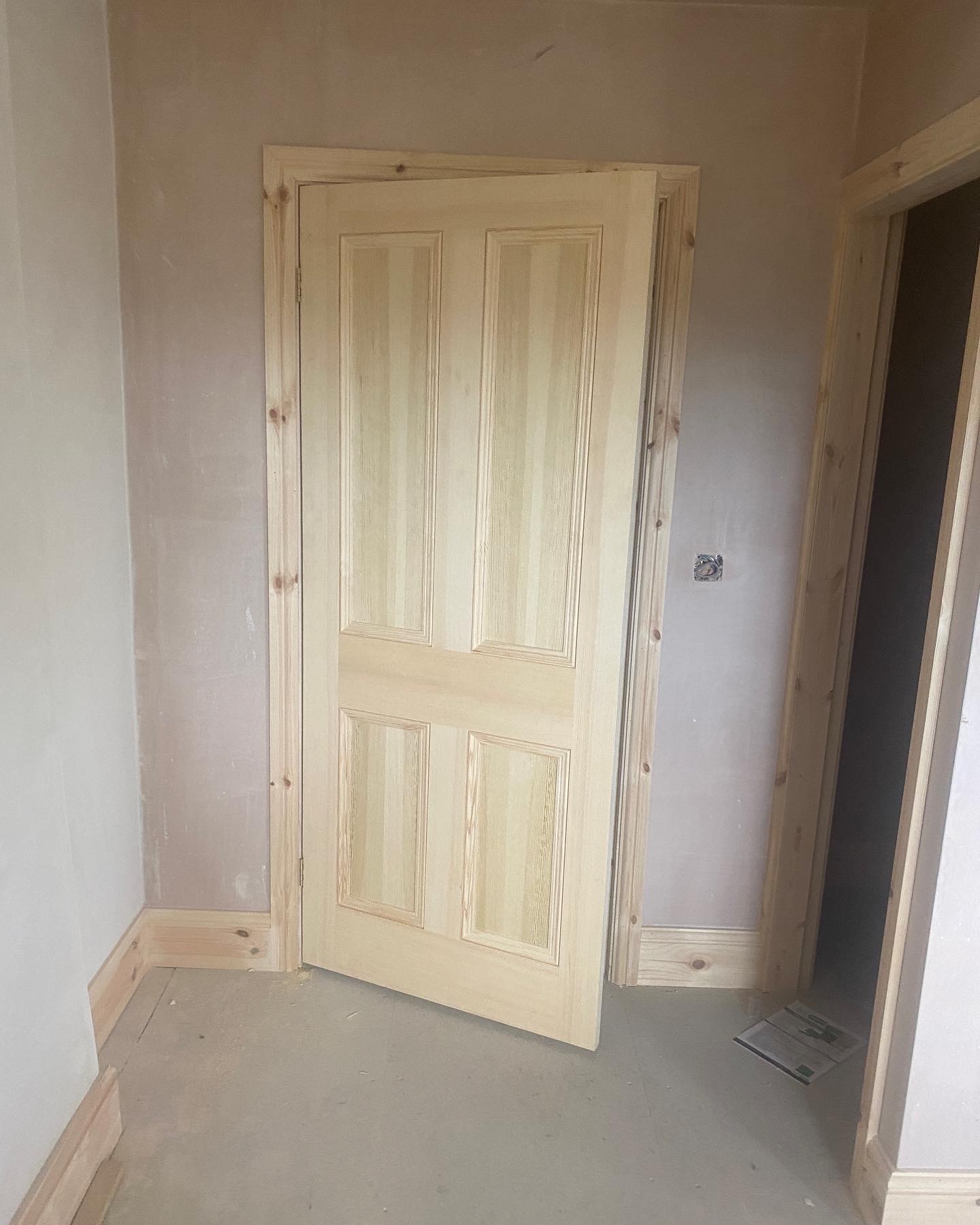 New four-panel pine door and lining