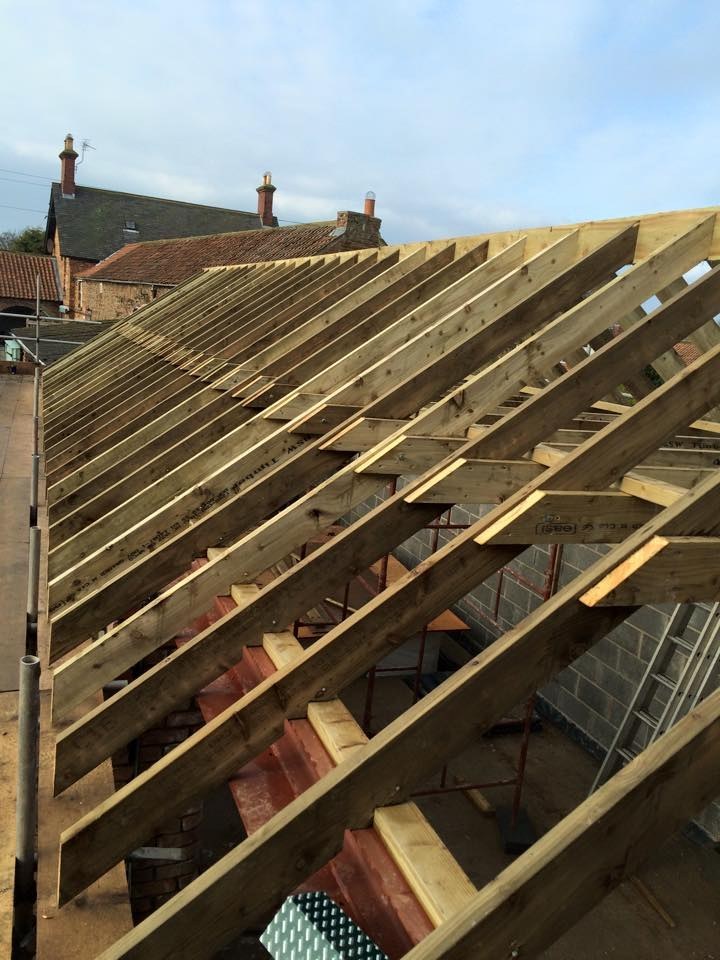 New rafters going up on a pitched roof