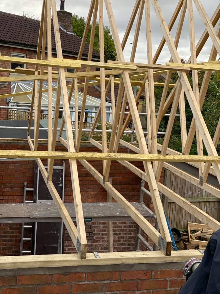 New roof trusses fixed on brick walls